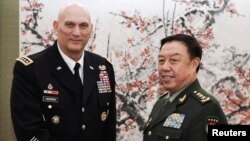 FILE - U.S. Army Chief of Staff General Ray Odierno (L) shakes hands with Fan Changlong, vice chairman of China's Central Military Commission, at Bayi Building in Beijing, Feb. 21, 2014. 