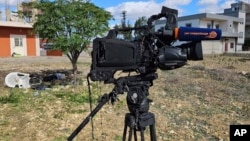 The damaged camera of pan-Arab TV network Al-Mayadeen cameraman Rabih Maamari, who was killed in an Israeli strike, is seen at the Lebanese border village of Tair Harfa near the border with Israel, Tuesday, Nov. 21, 2023.