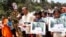 People march to the killing site of Cambodian anti-logging activist Chut Wutty in Koh Kong province, May 11, 2012.