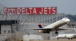 FILE - A Delta Airlines jet departs Hartsfield Jackson Atlanta International Airport in Atlanta, Georgia, Apr. 14, 2008.