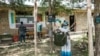 A woman casts her ballot at a polling station during Tigray’s regional elections, in the town of Tikul, 15 kms east from Mekele, Ethiopia, Sept. 9, 2020.