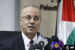 Palestinian Prime Minister Rami Hamdallah speaks during a press conference in the West Bank city of Ramallah, Jan. 16, 2017.