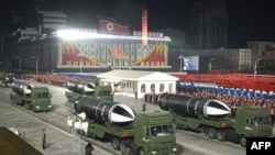This picture taken on Jan. 14, 2021, and released by North Korea's official Korean Central News Agency shows what appears to be submarine-launched ballistic missiles during a military parade.