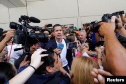 Venezuelan opposition leader Juan Guaido, who many nations have recognized as the country's rightful interim ruler, talks to the media after his arrival at the Simon Bolivar International airport in Caracas, Venezuela March 4, 2019.