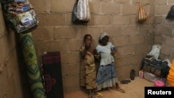 FILE - Children, who escaped Boko Haram attacks in both Michika and Cameroon, are seen inside an uncompleted house as they seek shelter in Adamawa, Nigeria, Jan. 31, 2015.