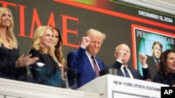 President-elect Donald Trump gestures after ringing the opening bell at the New York Stock Exchange, in New York, Dec. 12, 2024.