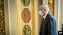U.S. Sen. Lindsey Graham, a Republican from South Carolina, walks on Capitol Hill on the fourth day of the Senate impeachment trial of former President Donald Trump on Feb 12, 2021, in Washington. 