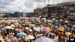 FILE - People shop at Mokolo market in Yaounde, Cameroon, Oct. 10. 2011.