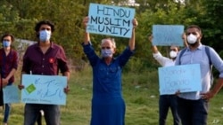 Members of a civil society group hold a demonstration demanding the government allow the construction of a Hindu temple, in Islamabad, Pakistan, July 8, 2020