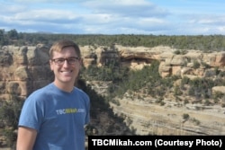 Mikah takes a "selfie" with one of the ancient cliff dwellings in Mesa Verde National Park.