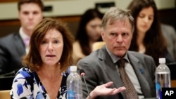 FILE - Fred Warmbier, right, listens as his wife, Cindy Warmbier, speaks of their son Otto Warmbier, an American who died in 2017 days after his release from captivity in North Korea, during a meeting at the United Nations headquarters, May 3, 2018.