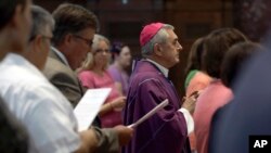 FILE - Bishop Ronald Gainer, of the Harrisburg Diocese, arrives to celebrate mass at the Cathedral Church of Saint Patrick in Harrisburg, Pa., Aug. 17, 2018. Gainer is named in a grand jury report on rampant sexual abuse by Roman Catholic clergy.
