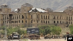 Afghan and foreign investigators inspect the site of a suicide attack in Kabul on , 18 May 2010