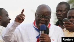 FILE - New Patriotic Party presidential candidate Nana Akufo-Addo, shown protesting in Accra after the 2012 election of John Dramani Mahama, is "campaigning hard" to defeat him in the next election, NPP acting chairman Freddie Blay says.
