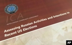 FILE - A part of the declassified version Intelligence Community Assessment on Russia's efforts to interfere with the U.S. political process is photographed in Washington.