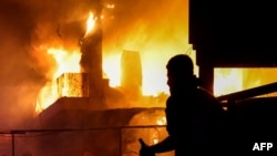Protesters clash with Lebanese security forces on Oct. 18, 2023, outside the US Embassy during a demonstration in solidarity with the people of Gaza in Awkar, East of Beirut, after a strike on a hospital in the Gaza Strip.