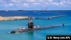 FILE - A fast-attack submarine returns to U.S. Naval Base in Guam, Aug. 19, 2021, in this photo provided by U.S. Navy.