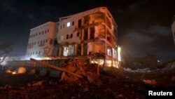 A damaged building is seen at the scene where a car bomb exploded targeting a Mogadishu hotel in a business center in Maka Al Mukaram street in Mogadishu, Somalia, Feb. 28, 2019.