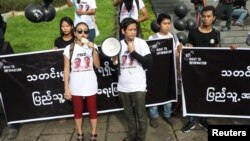 Thinzar Shun Lei Yi (L) speaks at a march for press freedom in Yangon, Myanmar, September 1, 2018.