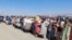 Afghan citizens wait with their belongings to cross into Afghanistan, after Pakistan gives the last warning to undocumented immigrants to leave, at the Friendship Gate of Chaman Border Crossing in Chaman, Pakistan, Oct. 31, 2023. 