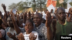 People pray during a rally against French satirical weekly Charlie Hebdo, which featured a cartoon of the Prophet Mohammad as the cover of its first edition since an attack by Islamist gunmen, in Bamako, Mali, Jan. 16, 2015. 
