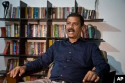 Asif Nazrul, a law professor at Dhaka University and a government critic, speaks to the Associated Press in Dhaka, Bangladesh, Jan. 1, 2019.