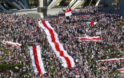 People take part in a protest against the presidential election results demanding the resignation of President Alexander Lukashenko and the release of political prisoners, in Minsk, Belarus, Aug. 16, 2020.