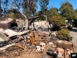 Charred property is seen in the Seminole Springs Mobile Home Park, Nov. 11, 2018, after a wildfire tore through the area in Agoura Hills, California.