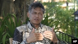 ASEAN Secretary-General Surin Pitsuwan speaks during an interview in Nusa Dua in Indonesia's resort island of Bali (file photo)