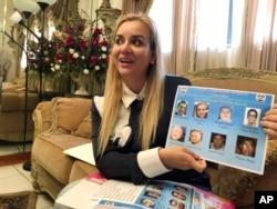 FILE - Darling Perez shows a copy of a Nicaraguan government wanted poster in which she is listed, during an interview in Miami, Oct. 15, 2018.
