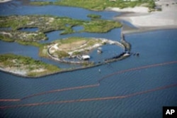Crew aboard the motor vessel Poppa John train to deploy fire-resistant oil-containment boom off the coast of Venice, Louisiana.