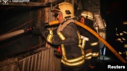 Firefighters work at the site of a Russian missile strike, amid Russia’s attack on Ukraine, at a location given as Odesa, Ukraine, in this State Emergency Service of Ukraine handout image released on May 2, 2024.