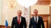 Russian President Vladimir Putin, left, and Russian Prime Minister Dmitry Medvedev walk prior to a cabinet meeting in Moscow, Russia, Jan. 15, 2020. 