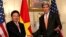 U.S. Secretary of State John Kerry (R) shakes hands with Vietnamese Deputy Prime Minister and Foreign Minister Pham Binh Minh before a working lunch at the State Department in Washington October 2, 2014. 