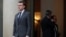 French President Emmanuel Macron accompanies a guest after a meeting at the Elysee Palace in Paris, Jan. 12, 2018.