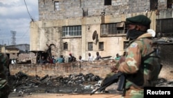 Members of the military patrol through the streets of Alexandra township as the country deploys the army to quell unrest linked to the jailing of former President Jacob Zuma, in Johannesburg, South Africa, July 15, 2021. 
