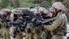 Tentara Israel berkumpul di sepanjang wilayah perbatasan Gaza Israel di Israel selatan pada 12 Desember 2023. (Foto: AFP)