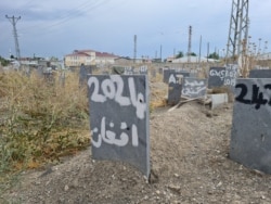 In an area of a graveyard set aside for the bodies of refugees found dead as they attempt to find safety, this grave says simply: "Afghan" on April 12, 2021 in Van, Turkey. (Heather Murdock/VOA)