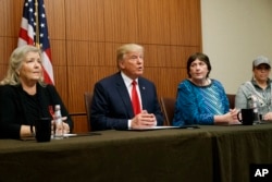 Republican presidential candidate Donald Trump, second from left, make remarks before the second presidential debate with Democratic presidential candidate Hillary Clinton, Oct. 9, 2016.