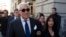  In this Nov. 15, 2019, file photo, Roger Stone, left, with his wife Nydia Stone, leaves federal court in Washington, Friday, Nov. 15, 2019.