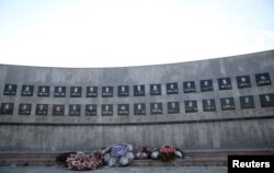 Flowers are seen at the memorial to the victims of the Racak massacre, where ethnic Albanians were killed by Serbian forces in January 1999, in the village of Racak, Kosovo, on Sept. 22, 2016.