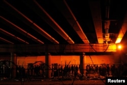 Migrants from Central America wait in a line for food inside an enclosure, where they are being held by U.S. Customs and Border Protection, after crossing the U.S.-Mexico border illegally and turning themselves in to request asylum, in El Paso, Texas, March 29, 2019.