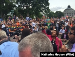 About 100 protesters waited outside the Capitol, in Washington, June 23, 2016. After ending their sit-in on the House floor, House Democrats exited the Capitol to thank supporters who had gathered.