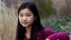 High school student Grace Hu, 16, sits for a photograph near Sharon High School, Sunday, April 11, 2021, in Sharon, MA.