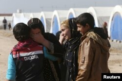 Displaced Iraqis, who fled the Islamic State stronghold of Mosul, meet their relatives in Khazir Refugee Camp, east of Mosul, Iraq Nov. 5, 2016.