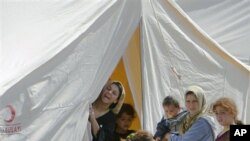 Syrian refugees are seen in a camp, in Boynuyogun, Turkey, Tuesday, June 14, 2011.