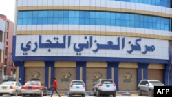 A Yemeni man walks past a closed shopping center on a deserted street in the heart of the Yemeni port city of Aden on April 2, 2020.