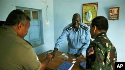 United Nation's military observers greet the Director of Police, Brig. Gen. William Chulo, in Renk, southern Sudan, 15 Sep 2010