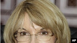 U.N. Under Secretary-General for Legal Affairs Patricia O'Brien smiles during a meeting with Cambodian Deputy Prime Minister Sok An in Phnom Penh, Cambodia, October 20, 2011.