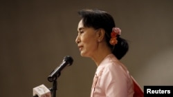 FILE - Myanmar pro-democracy leader Aung San Suu Kyi gives a speech during a World Press Freedom Day ceremony in Yangon, May 3, 2015. 